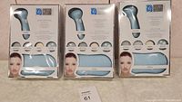 Three boxed Global Beauty Care Power Brush Skin Cleansing Systems in original packaging.