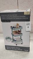 Full box front showing the cart and branding with dimensions and quantity details.