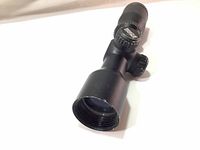 Full view of Excalibur Dead Zone 32mm scope showing adjustment turrets and objective lens.