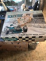 Closed Scalextric original box with vintage racing car artwork showing the product name and branding.