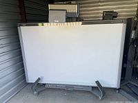 Front view of SMART Board mounted on rolling stand with short throw projector above