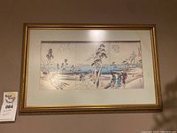 Framed Asian art print with winter scene of people near water and trees