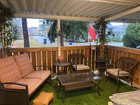 Full overview of all seating units and tables grouped under covered patio