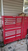Front view of full Homak tool chest set showing top chest, lower cabinet and side locker on casters