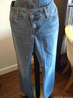Light washed pair of jeans on mannequin showing fit and style