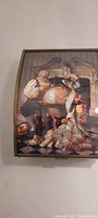 Top view of the music box showing the artwork of Santa Claus reading a list by a globe in a detailed room setting.