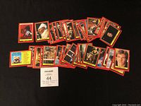 43 Star Wars Return of the Jedi collector cards laid out on a surface with red borders, showing various characters and scenes.