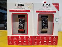 Front view of two iTime Elite smartwatch boxes showing watch display with body temperature and time. Packaging shows price $49.97 and key features.