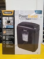 Front view of the Fellowes PowerShred 8C shredder box showing brand, model, and key features.