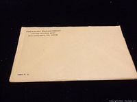 Front view of sealed envelope labeled Treasury Department United States Mint, Philadelphia PA with marking 1964 P.C.