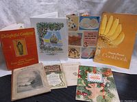 Photo showing a group of 10 vintage cookbooks and recipe booklets including Betty Crocker, Aunt Jenny's and Chiquitta Bananas variously sized with different illustrated covers.