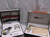 Echo watch set including multi-colored face watch, three leather watchbands and two silver-tone clips
