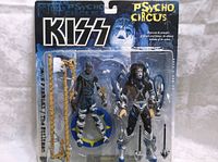 Original KISS Psycho Circus blister card packaging showing Ace Frehley and The Stiltman figures and accessories.
