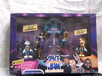 Front view of boxed Space Jam: A New Legacy Elite Tune Squad set with 4 figures and basketball hoop.
