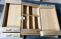 Five Ikea RATIONELL drawer organizers with different compartment sizes and some in original cardboard boxes.