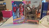 Front photo showing both boxed dolls side by side, GI Joe on the right, Baywatch Barbie on the left
