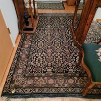 Main view of the entire rug showing overall pattern, border and condition