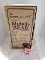 Box packaging for The Boyd's Collection Original Mohair Bear Collection featuring Theodore M. Bear exclusive edition 100th anniversary teddy bear branding.