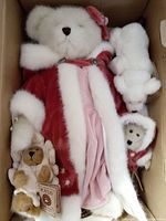 Photo of three Boyd's Best Dressed Bears: large Genevieve Frostberry bear dressed in red and pink, smaller Maddie bear in red and white, and small polar bear figure Polaris inside a box.