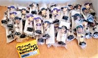 Lot of 34 assorted vintage Fotoball football player bobbleheads in original plastic bags with partial view of packaging and yellow lot tag.