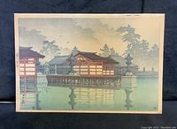 Full front view of print depicting shrine buildings on water in fog, showing overall composition and condition