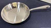 Top and interior view of the 7.5-inch All-Clad LTD frying pan showing the polished stainless steel interior and handle attachment.