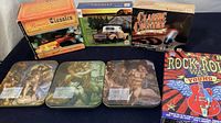 Full view of the classic music CD collection showing boxed sets and three collectible tins.
