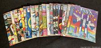 Photo showing 20 comics fanned out with various cover arts.
