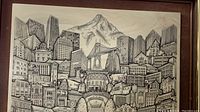 Close-up of framed vintage tile artwork showing detailed Portland cityscape and Mount Hood.