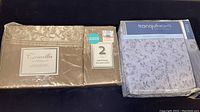 Camilla and Tranquil Nights queen sheet sets in original packaging, showing brand labels and packaging wear.