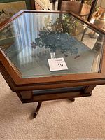 Top view showing hexagonal glass lid and wood frame