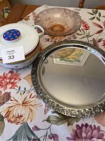 Photo shows the three items: silver rim round mirror plate, translucent rose pedestal glass dish, and decorative ceramic soup bowl with lid and blue floral knob.