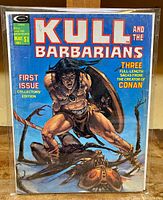 Front cover of Kull and the Barbarians #1 comic, showing title and central warrior figure with shield.