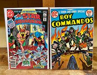 Front covers of both comics shown side by side. All Star Squadron #1 priced at 50 cents, Boy Commandos #1 priced at 20 cents. Covers show detailed illustrations and vibrant colors reflecting the original comic artwork.