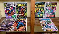 Eight Doctor Strange comic books displayed in bags, showing front covers including Doctor Strange Classics and various numbered issues.