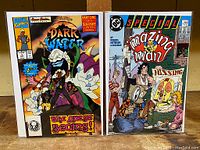 Two comic books side by side: Pirates of the Dark Water #1 on the left and 'Mazing Man Special #1 on the right, showing full front covers.