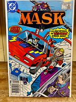 Front cover of MASK #1 comic book featuring dynamic action artwork and logos from DC Comics and First Issue.