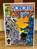 Front cover showing the colorful artwork and title of the Robotix #1 comic book by Marvel, highlighting the 1st issue status, price, and publication date.