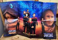 Full view of the colorful Star Trek promotional poster featuring main characters and series logos.