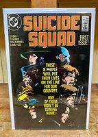 Front cover of Suicide Squad #1 comic book, showing character portraits and title in bold lettering.