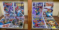 Seven vintage comic books from The Mighty Thor series displayed on wooden surface, showing front covers.