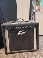 Front view of Peavey amplifier showing logo and front grille.
