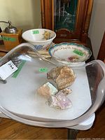 Five hand painted 6x6 tiles, two floral bowls, crystallized rocks, and an acrylic bowl shown on table.