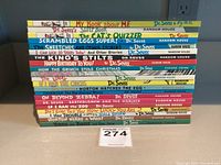 Photo showing stack of 18 beginner children's books by Dr. Seuss with titles visible.