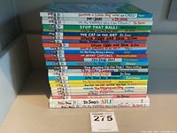 Stack of 25 children's books showing titles and authors, mostly Dr. Seuss books and other well-known children's series.