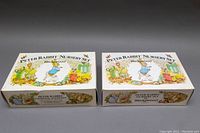 Two original boxed Wedgwood Peter Rabbit nursery sets side by side, showing box artwork and branding.