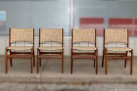Front view of all four chairs in a row on concrete surface