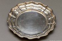 Top view of sterling silver bowl showing ruffled edge and polished surface with minor scratches.