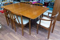 Full view of dining table with chairs arranged around it