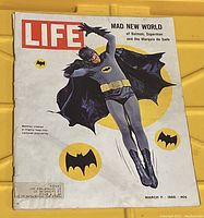 Front cover of the 1966 Life magazine featuring Batman (Adam West) in costume jumping, with Batman logos and yellow circle.